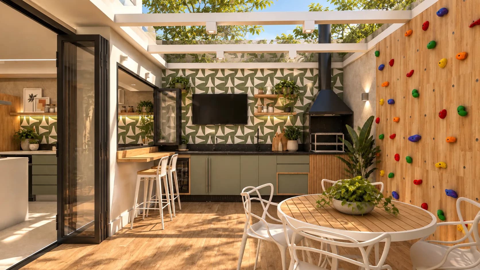 Área gourmet coberta com churrasqueira, mesa redonda e parede de escalada