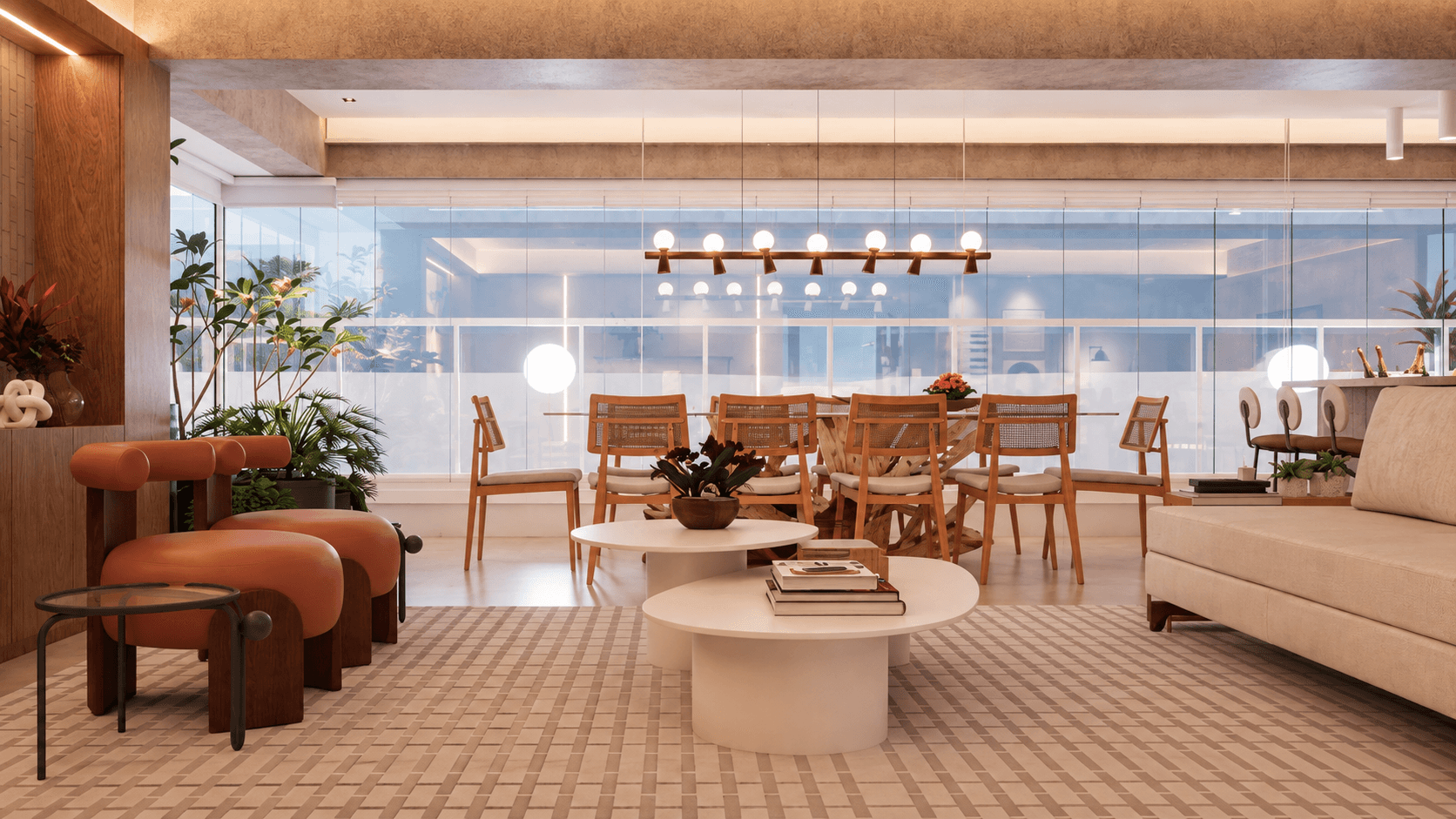 Sala de jantar com mesa de base escultural, cadeiras de madeira e palhinha e pendente linear, vista da sala de estar com poltronas laranja e mesas de centro brancas